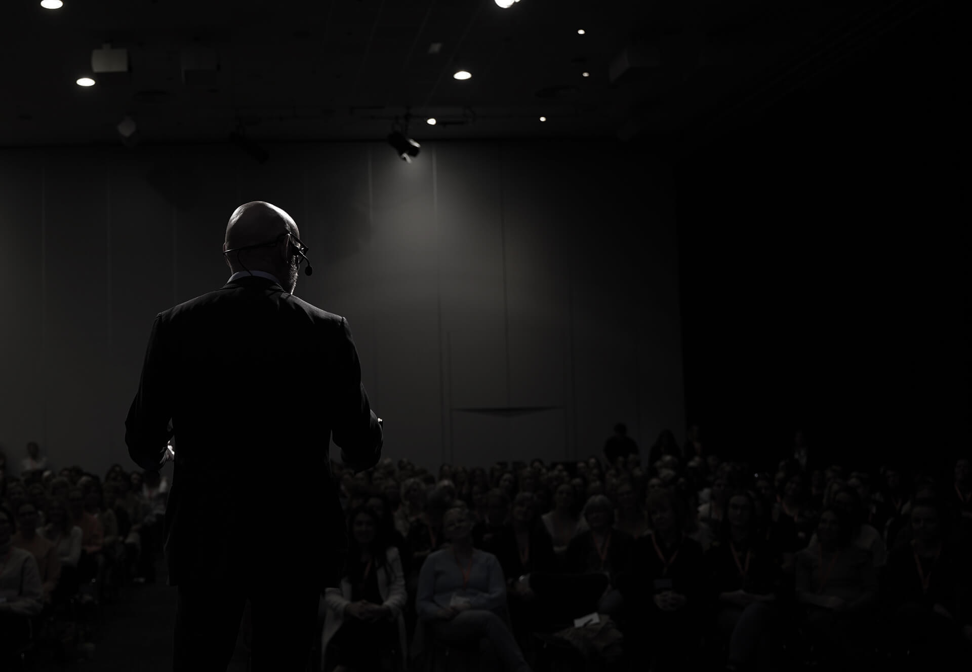Tomas is talking in front of an audience